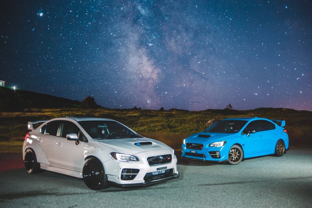 sports cars under starry night