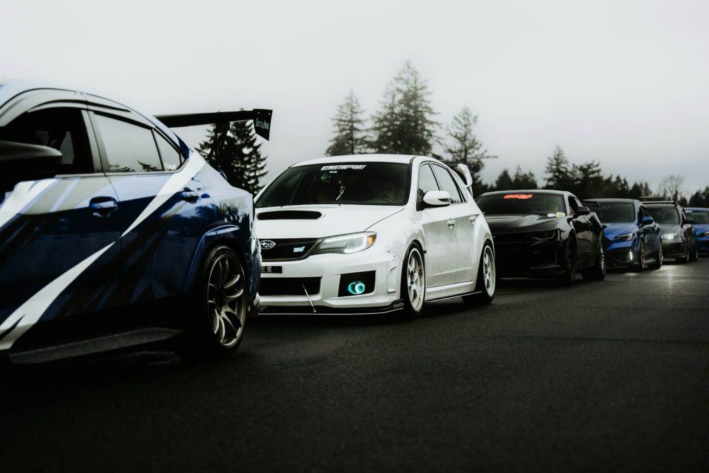 line of modified sports cars